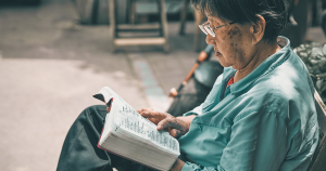 Elderly asian woman reading
