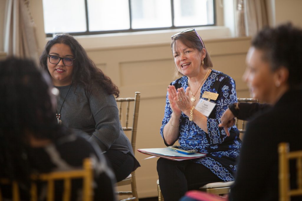 Diverse group of women talking at a book club meeting