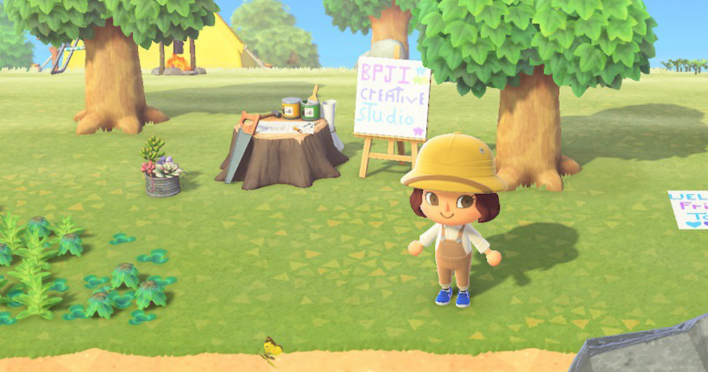 A screenshot from the video game Animal Crossing featuring a crafting table and sign reading BPJI Creative Studio