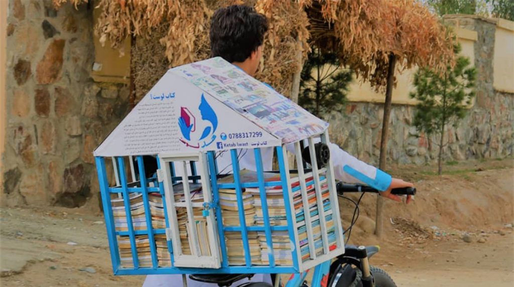 A mobile library atop a bicycle in Afghanistan