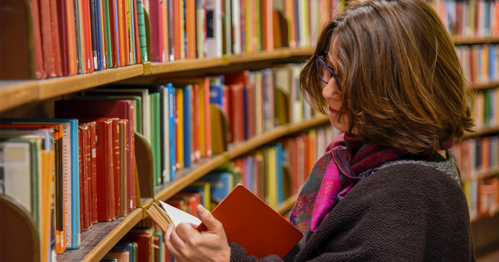Woman browsing library shelves