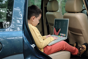 child on laptop computer