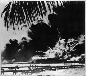 Pearl Harbor naval base and U.S.S. Shaw ablaze after the Japanese attack
