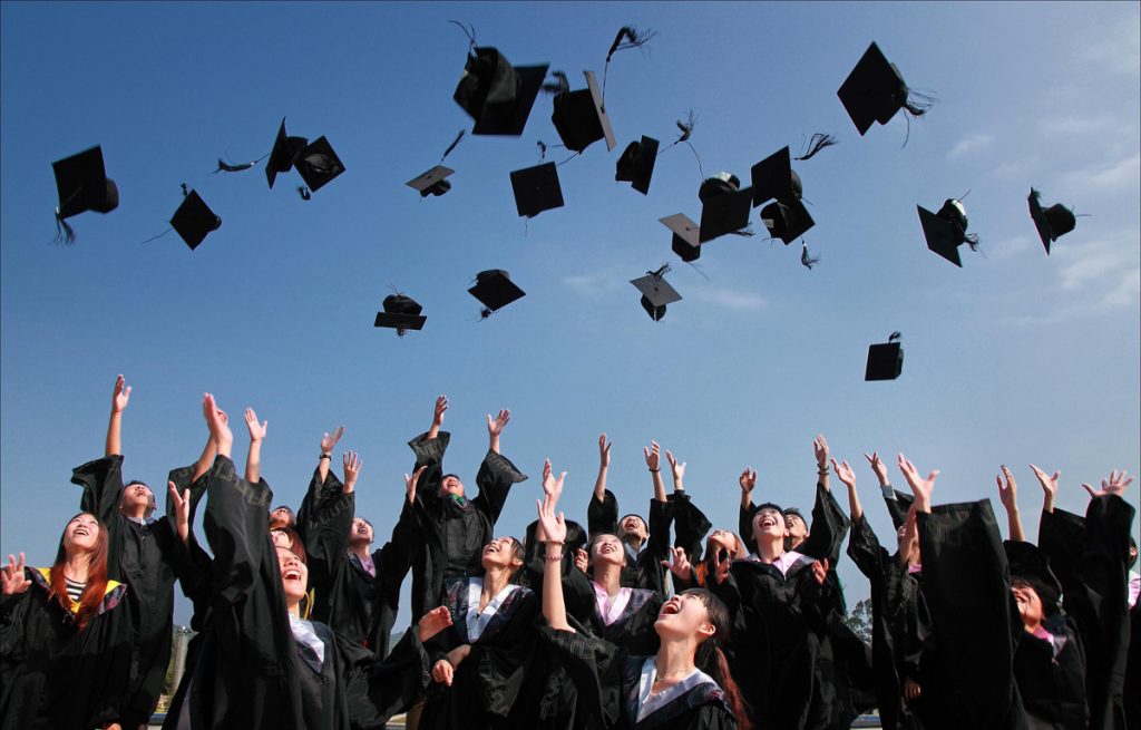 Graduation throwing hats