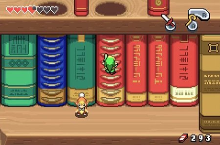 Link climbs up the spine of a book in the Hyrule Town Library in The Legend of Zelda: The Minish Cap. Screenshot by Chase Ollis / Nintendo.
