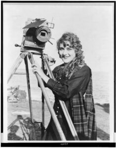 Mary Pickford with movie camera in the 1910s.
