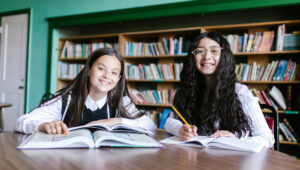 two kids in school library