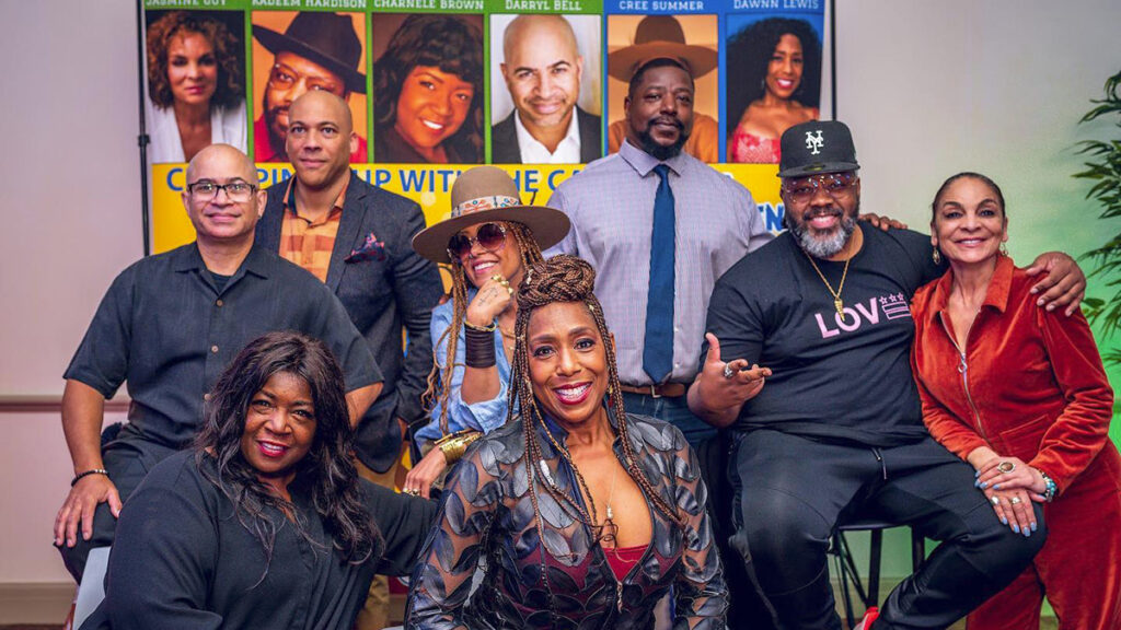 Librarian Jamar Rahming with the cast of cast of “A Different World.”