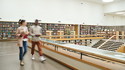 People walking through library