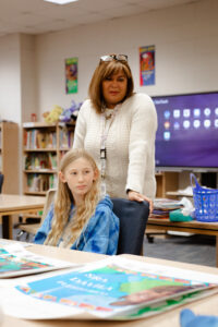 A student and teacher at Hawthorne Elementary School brainstorm ideas for the Growing Readers, Growing Leaders program. Courtesy of Hawthorne Elementary School.