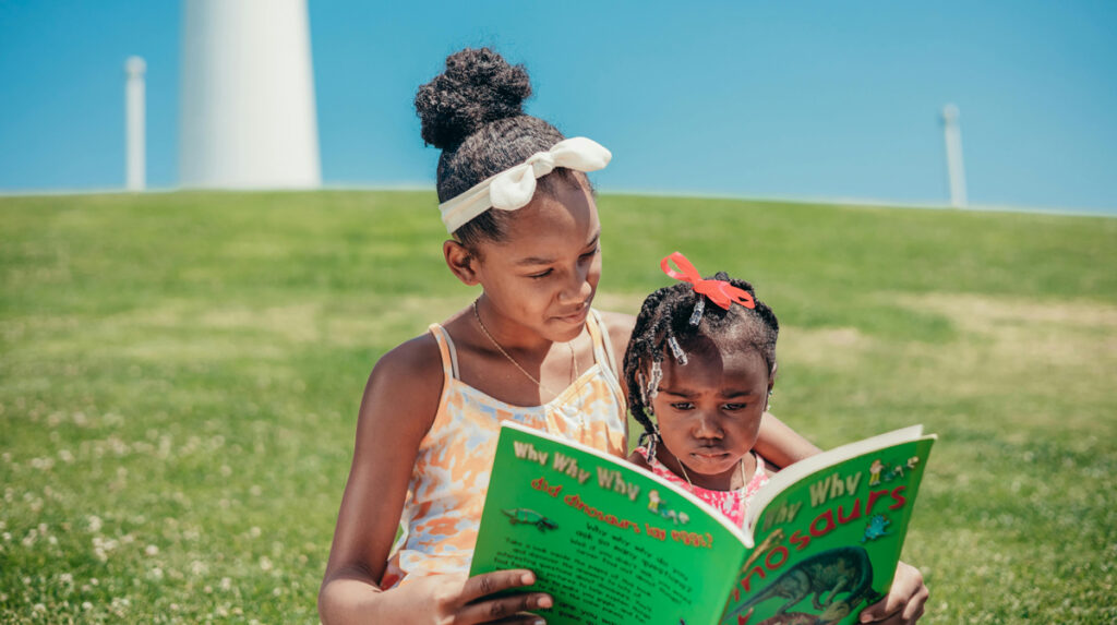Kids reading outside