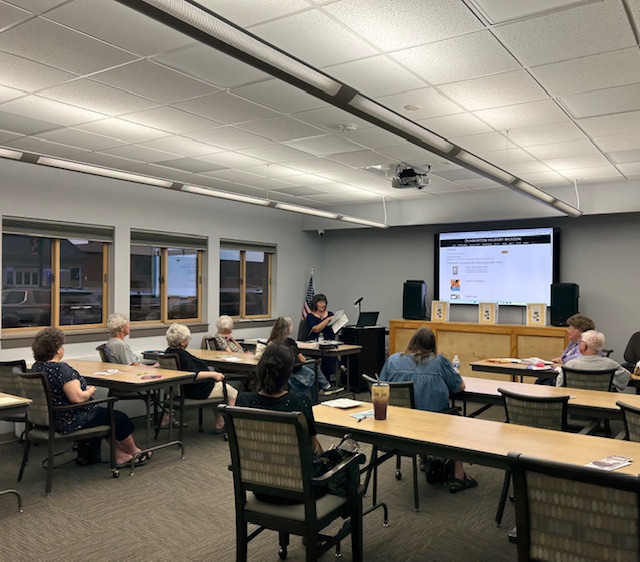A presenter uses a room in Dunkerton Public Library fitted with a new TV and sound system, LED and panel lights, and chairs made possible with funds from ALA’s Libraries Transforming Communities: Accessible Small and Rural Communities grant.
