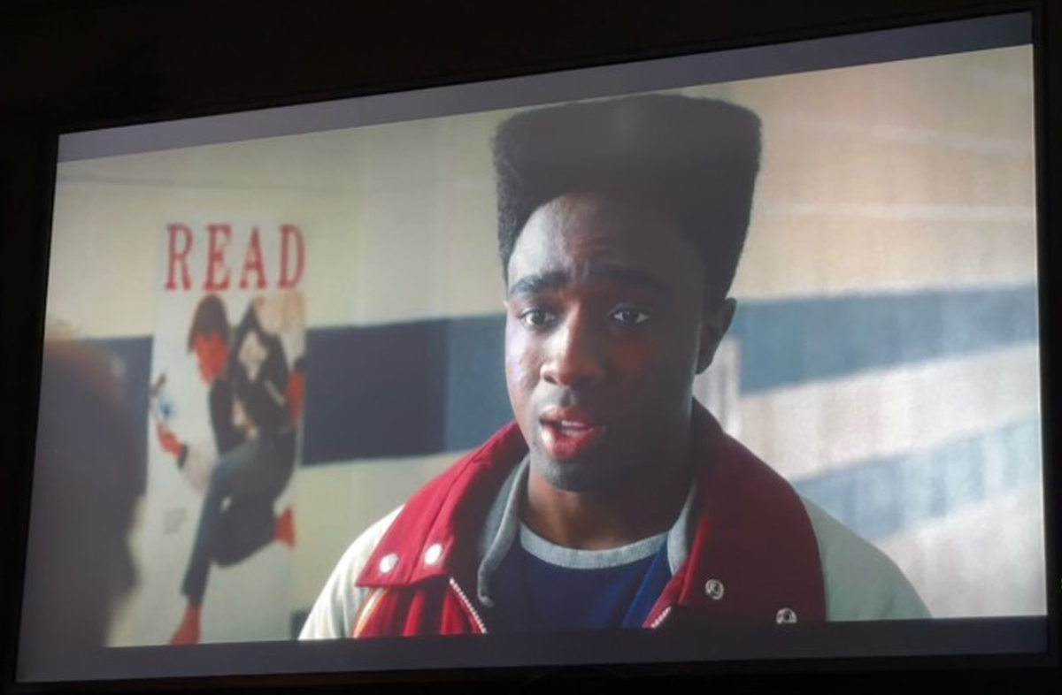 Screen grab from Stranger Things showing David Bowie READ poster