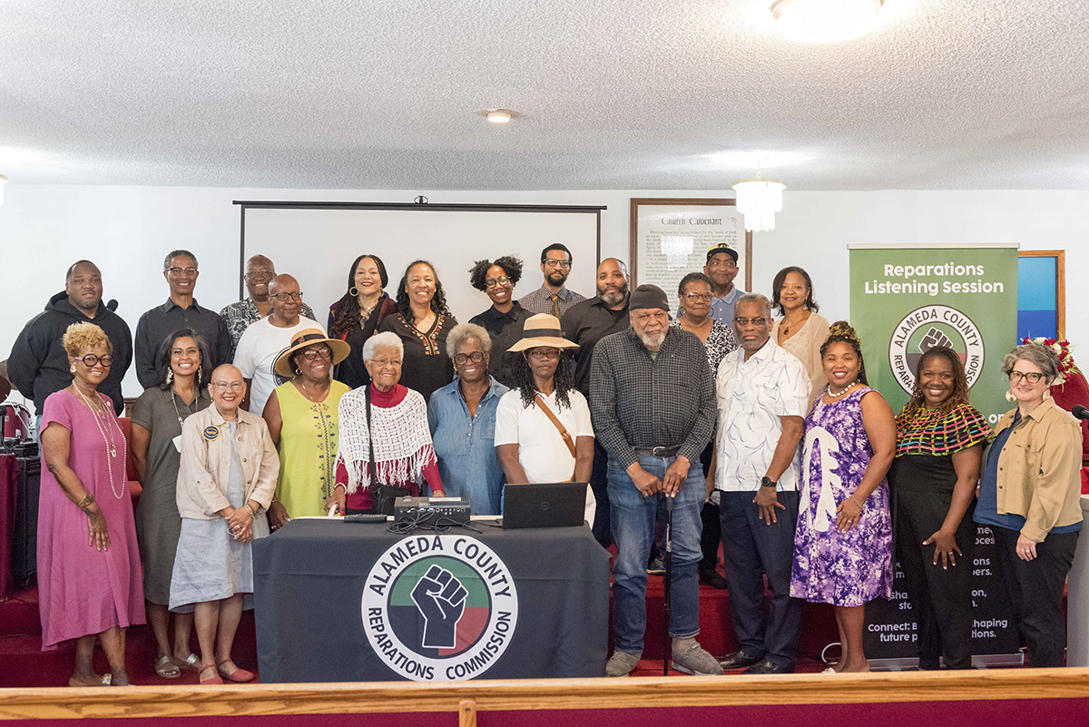 Photo of the Alameda County Reparations Committee, with Deb Sica standing on the far right