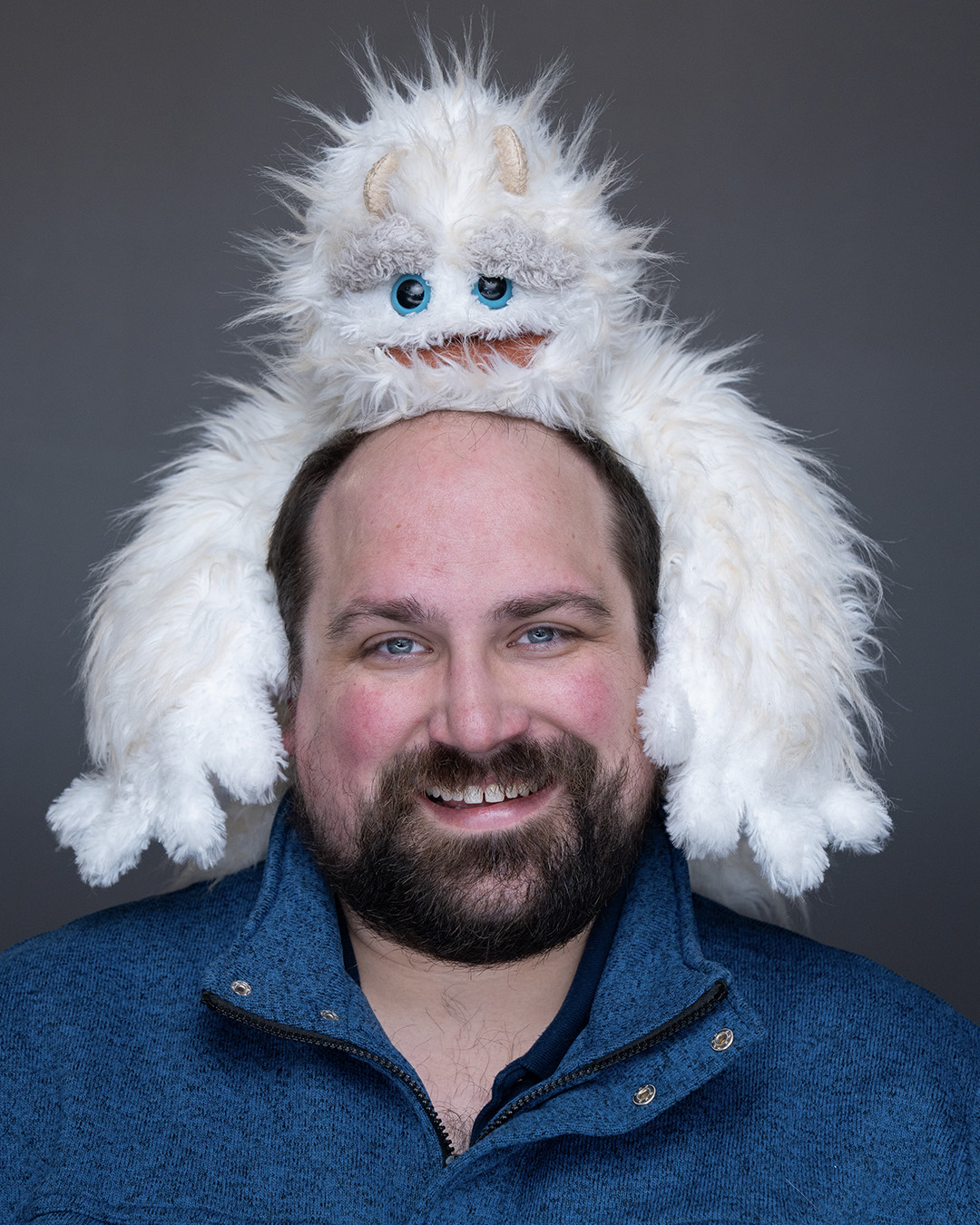 Photo of Zachary Stier with a puppet on his head