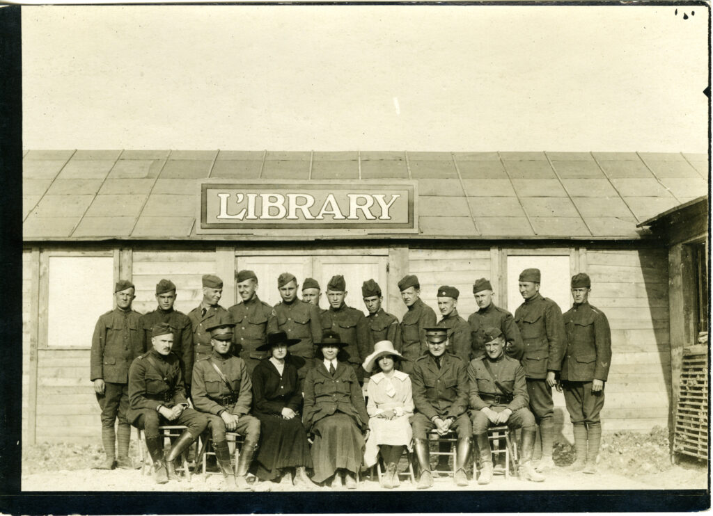 Servicemen and camp librarians in front of a American Library Association camp library in Le Mans, France. 1918. From the ALA Archives.