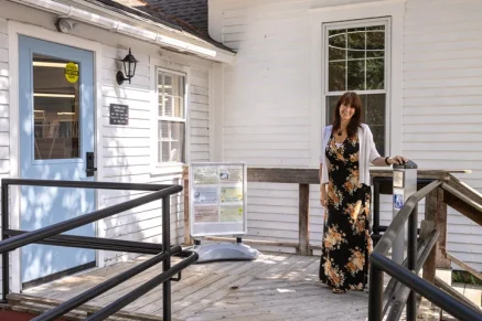 Lee Public Library director Hayley Van-Gils stands outside the library.
